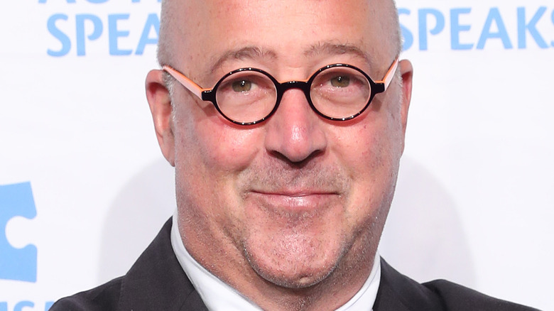 Andrew Zimmern smirking