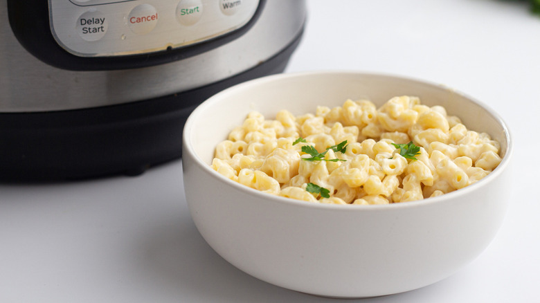 macaroni and cheese next to Instant Pot