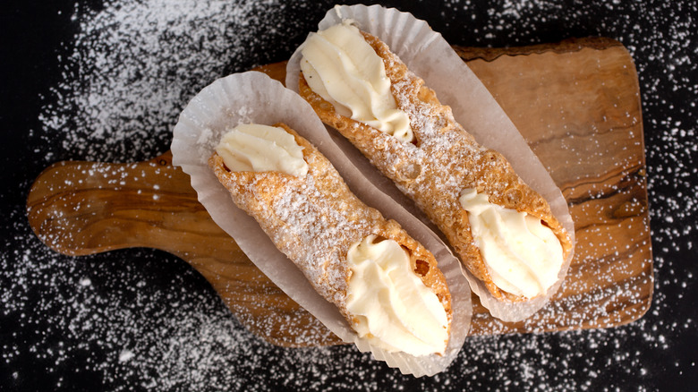 Cannoli on a wooden board