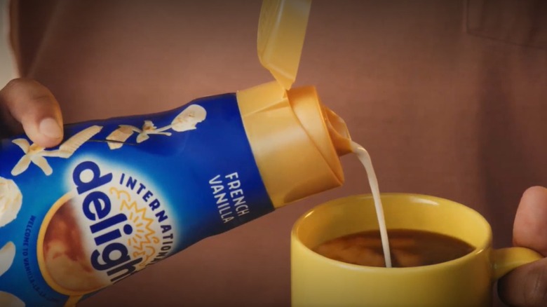 International Delight French Vanilla creamer being poured into cup