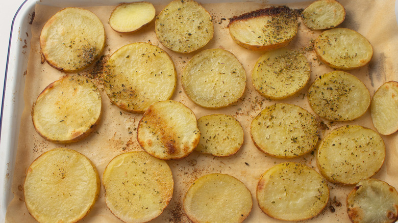seasoned potato slices on pan