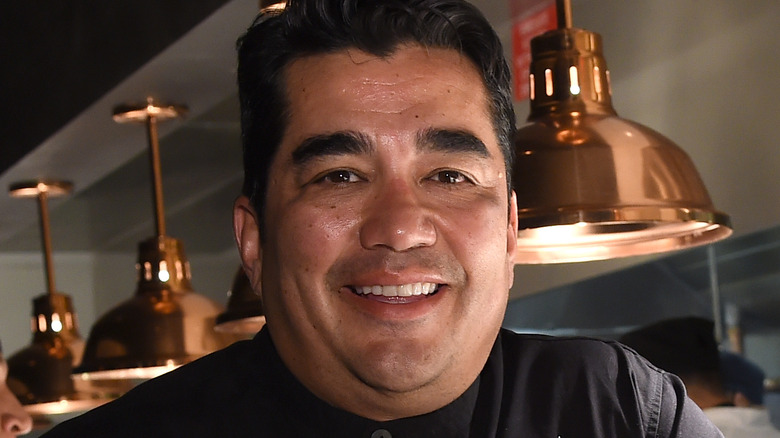 Chef Jose Garces with kitchen backdrop