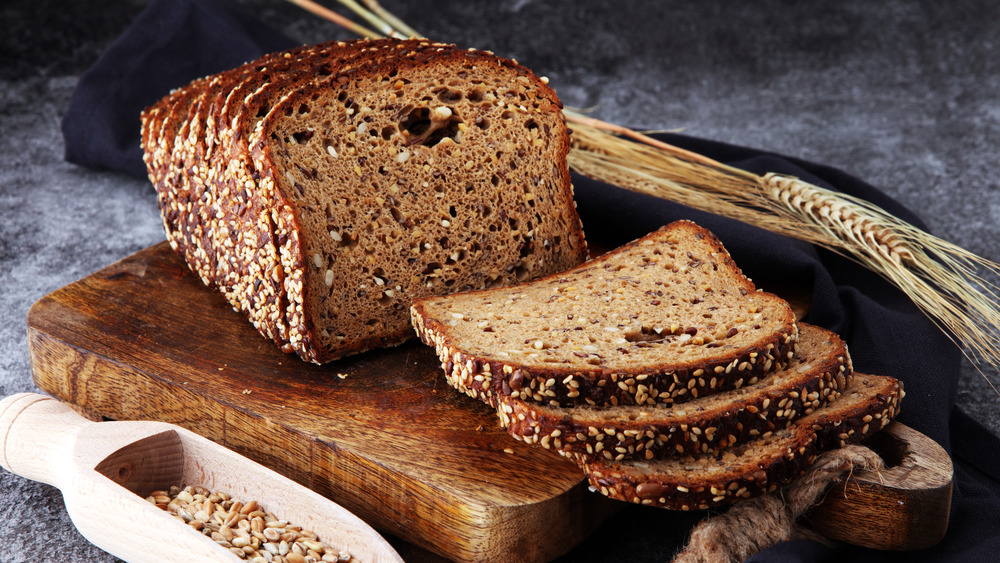 loaf of rye bread on cutting board