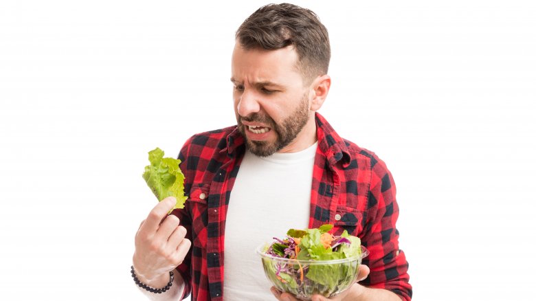 man horrified by lettuce