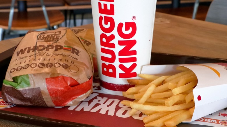 Burger King whopper, fries, and drink on tray