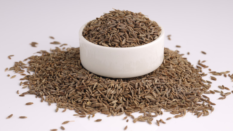 Whole cumin seeds in bowl
