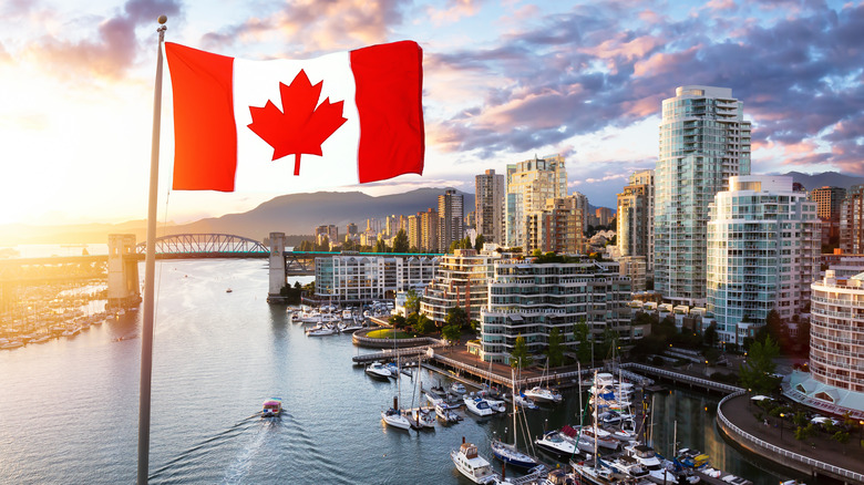 Canadian flag over city