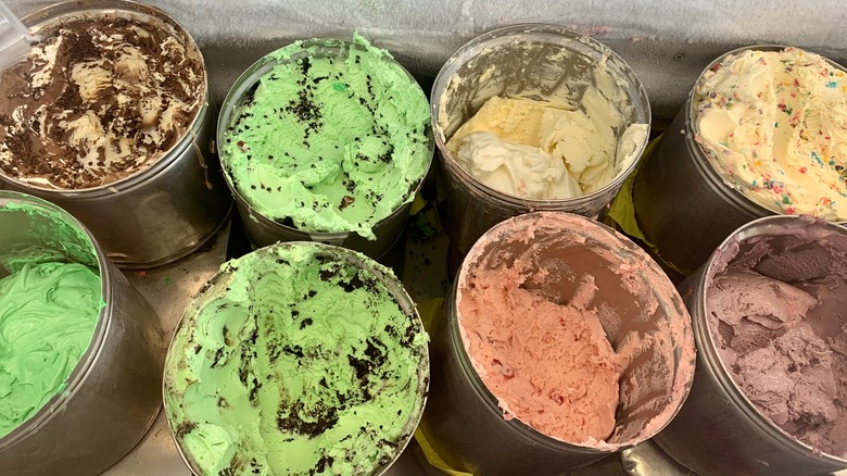 Tubs of ice cream in industrial freezer