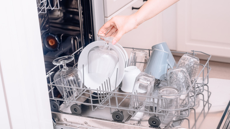 Placing dishes in dishwasher
