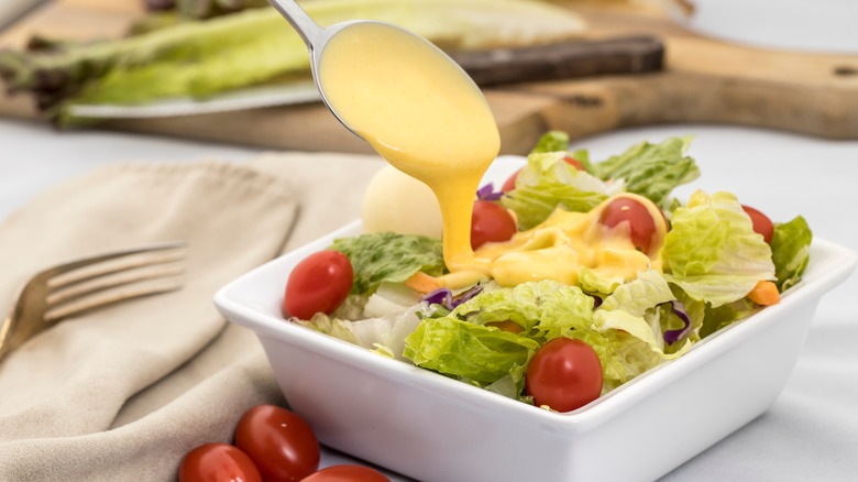 Dressing pouring on a salad