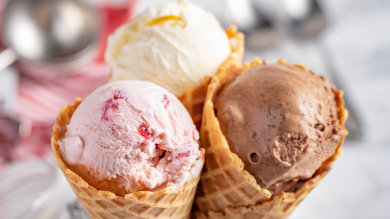 Vanilla, chocolate, and strawberry ice cream cones