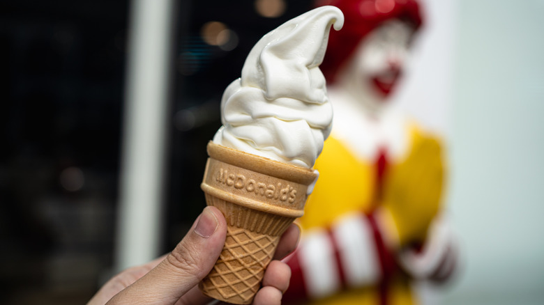 Person holding McDonald's cone