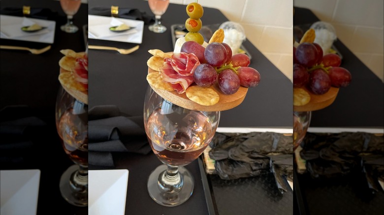 Charcuterie board on wine glass