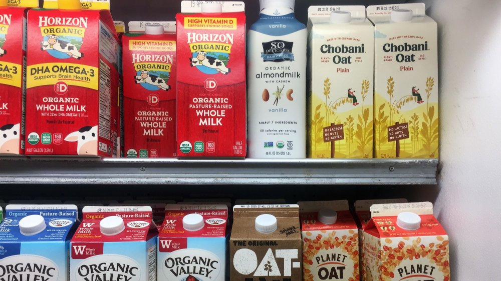 dairy and oat milk on shelves