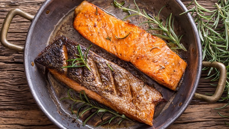 salmon with rosemary in a pan