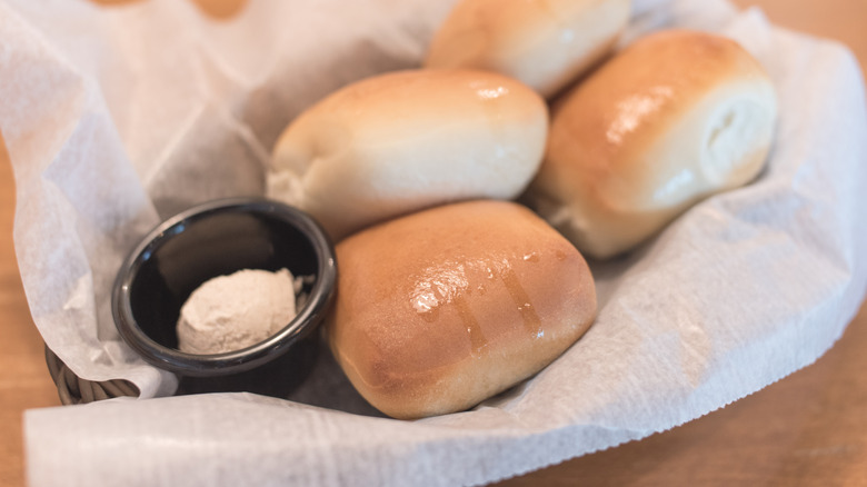 Fresh Texas Roadhouse rolls with a side of cinnamon butter