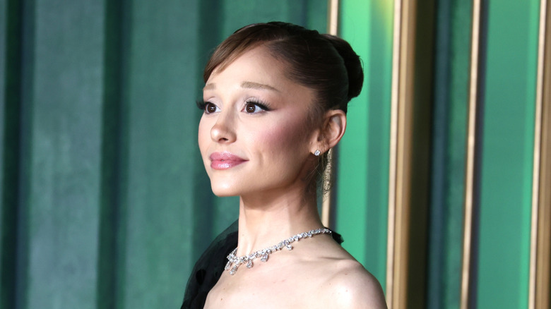 Ariana Grande posing at media event.