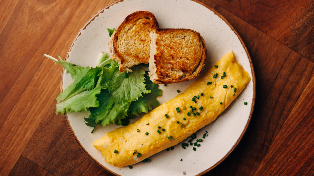 French omelette with toast and lettuce