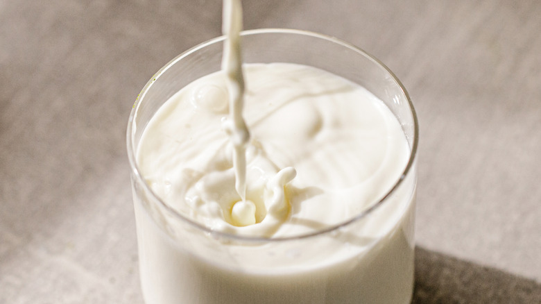 Milk pouring into glass