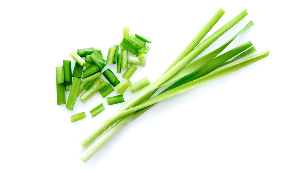 Green onions chopped on white background