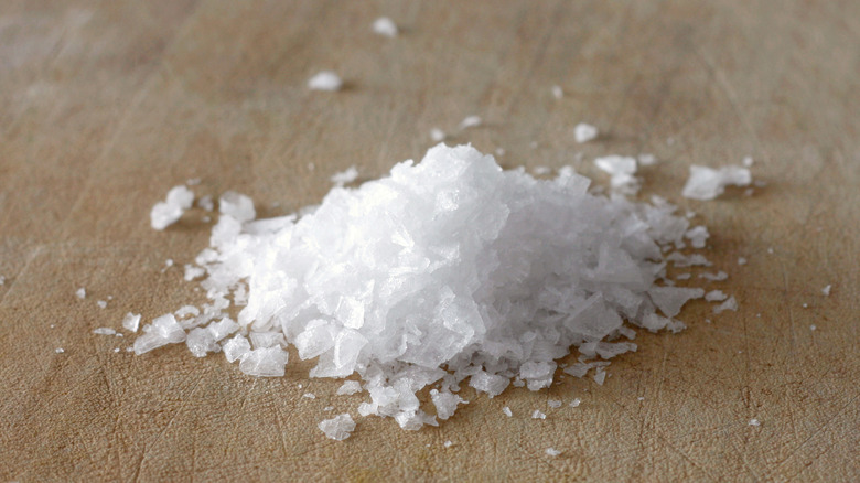 Pile of sea salt on the table 