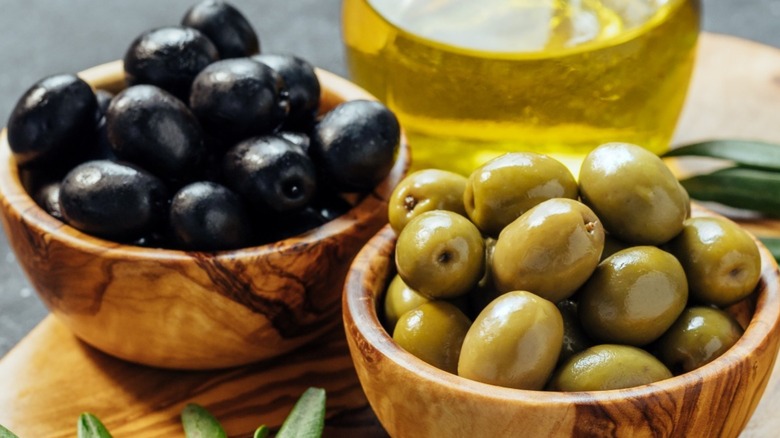 Bowls of green and black olives 