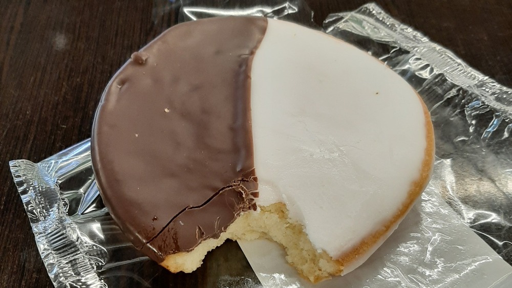 Black and white cookie with a bite