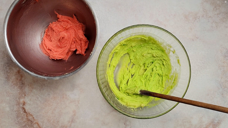 colored cake batter in bowls