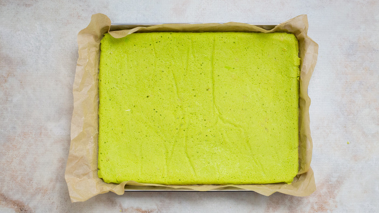 flat green cake in pan