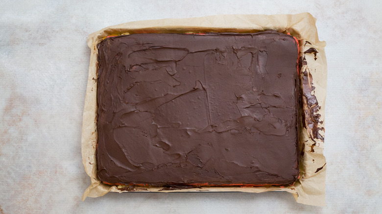 chocolate-covered cake on marble table