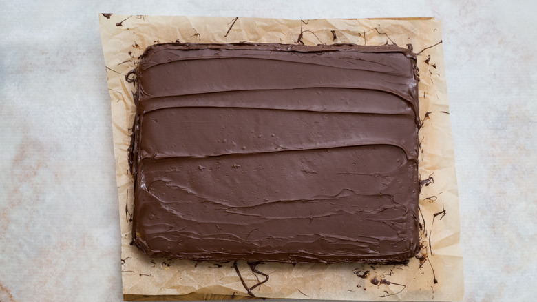 chocolate-covered cake on marble table