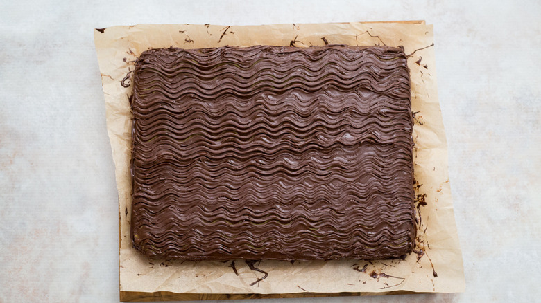 chocolate-covered cake on marble table