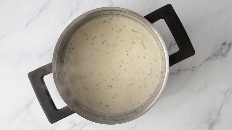 Creamy sauce in saucepan