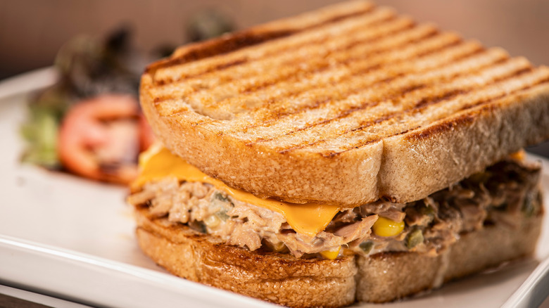 close up of grilled tuna melt sandwich with cheese