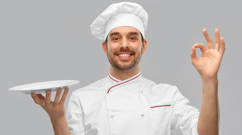 Chef holding plate