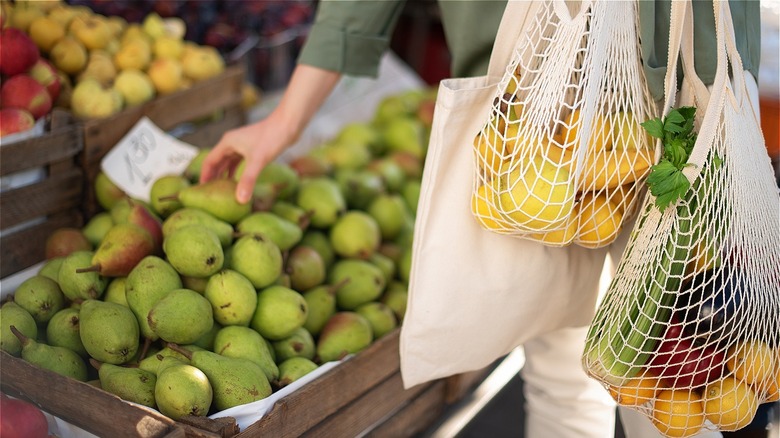 grocery shopper with reusable shopping bag
