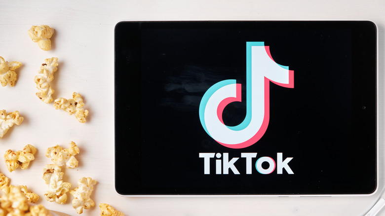 TikTok logo displayed on screen by popcorn