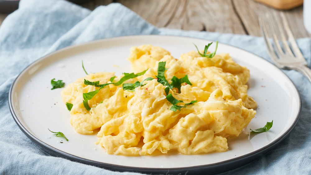 White plate with scrambled eggs