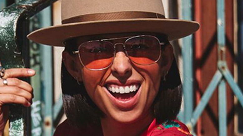 Jade Catta-Preta wearing sunglasses and hat