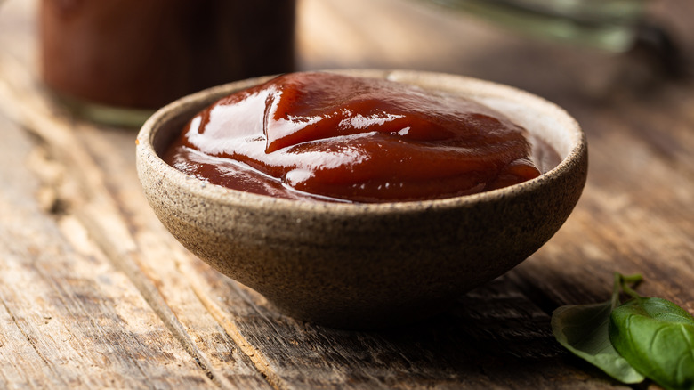 Small bowl of barbecue sauce on counter