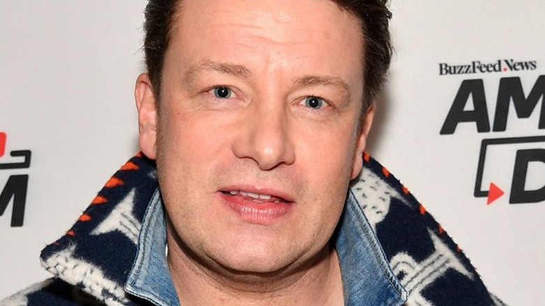 Jamie Oliver smiling jean jacket