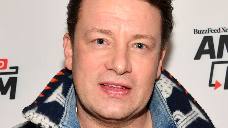 Jamie Oliver smiling with mouth open