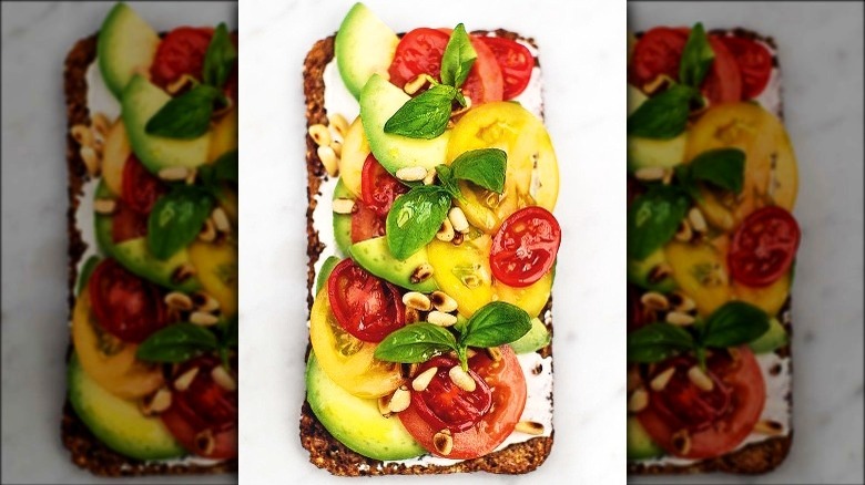 toast with avocado, tomato, basil, ricotta
