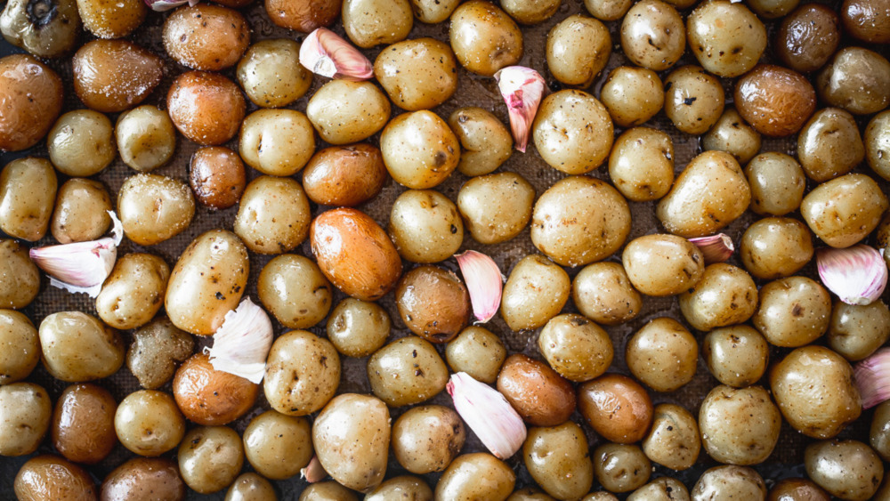 uncooked potatoes on baking dish