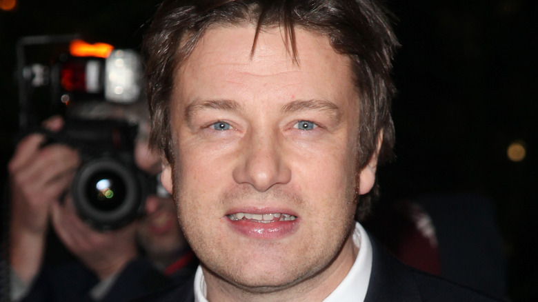 Jamie Oliver posing on the red carpet