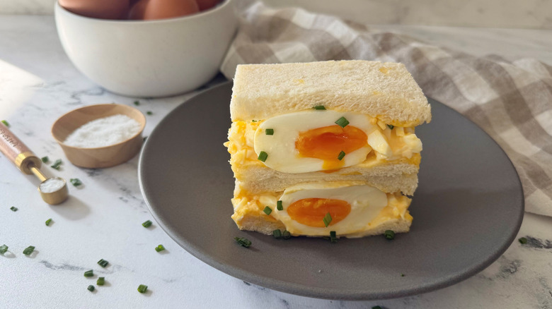 Japanese egg salad sandwich halves stacked on plate