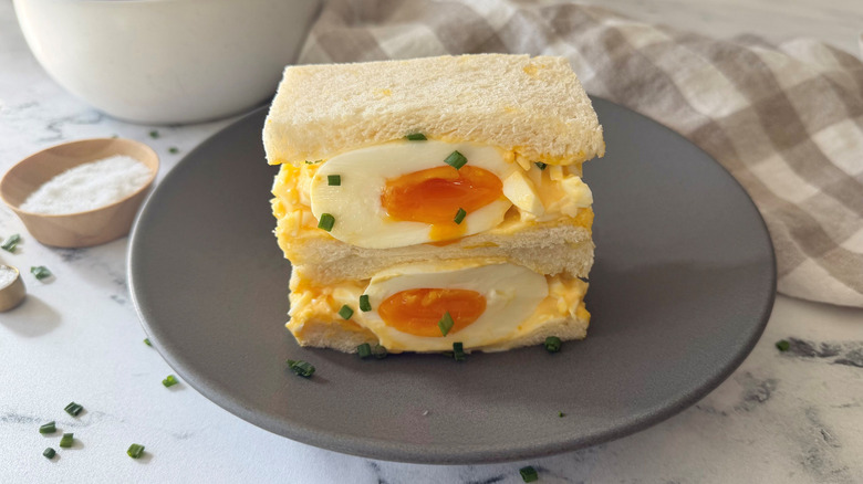 Japanese egg salad sandwich halves stacked on plate