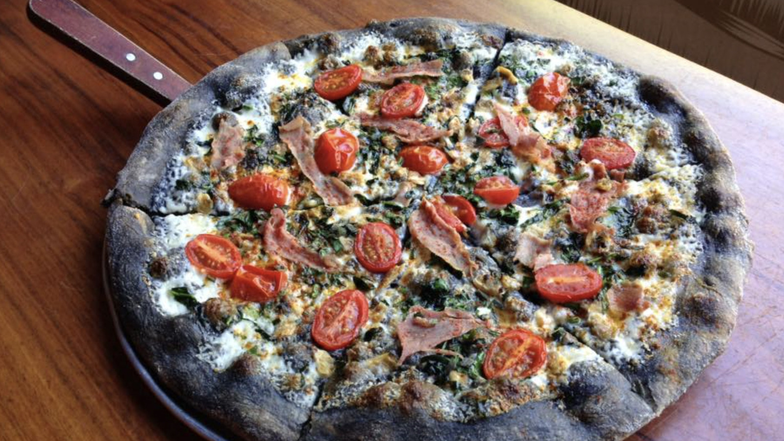Japan's Squid Ink Pizza Adds A Briny Taste To Every Bite