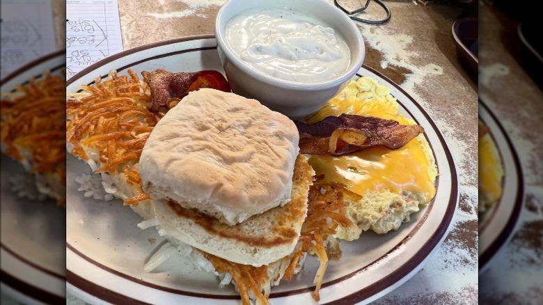 Biscuits and gravy with eggs and bacon at Waveland Cafe