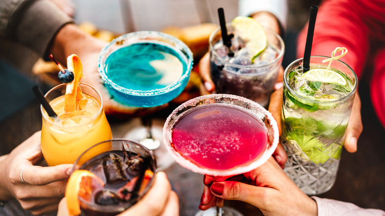 six different cocktails being held